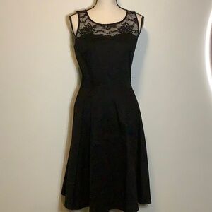 Black lace detailing retro style dress with waist tie.